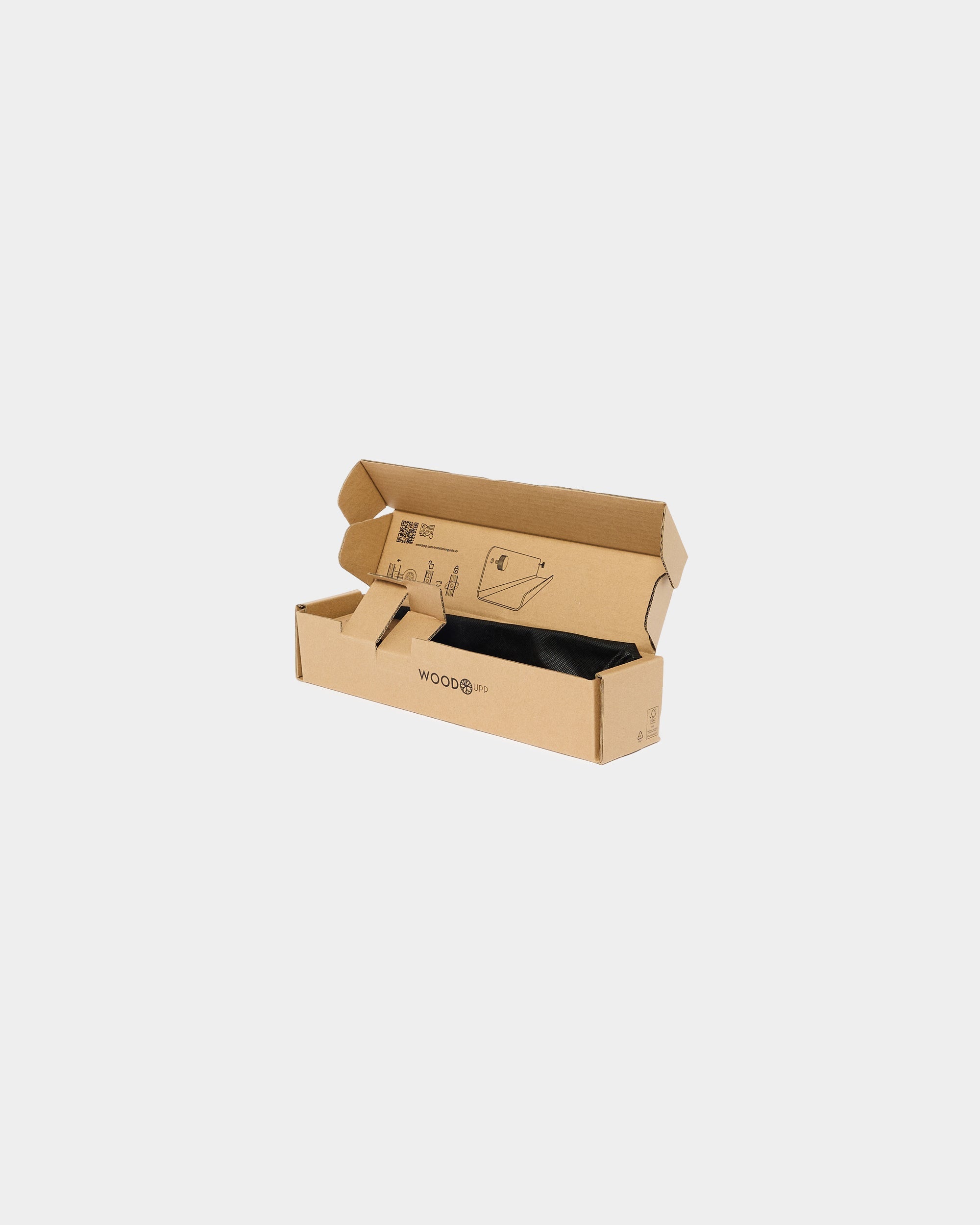 Open cardboard packaging box with printed instructions and the word Woods on the side, designed for secure shipping and storage of acoustic wood panels.